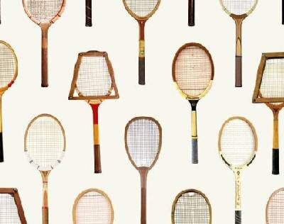 Tennis Rackets of Different Types on a White Surface